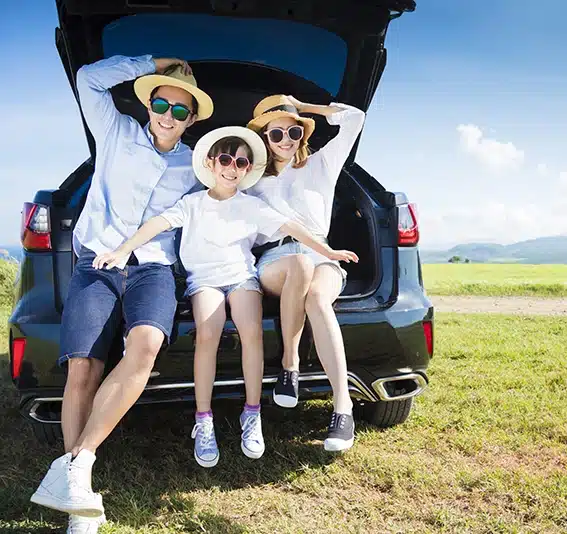 happy family enjoying road trip and summer vacation