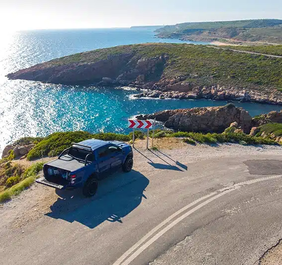 Drone view blue pick up on the road
