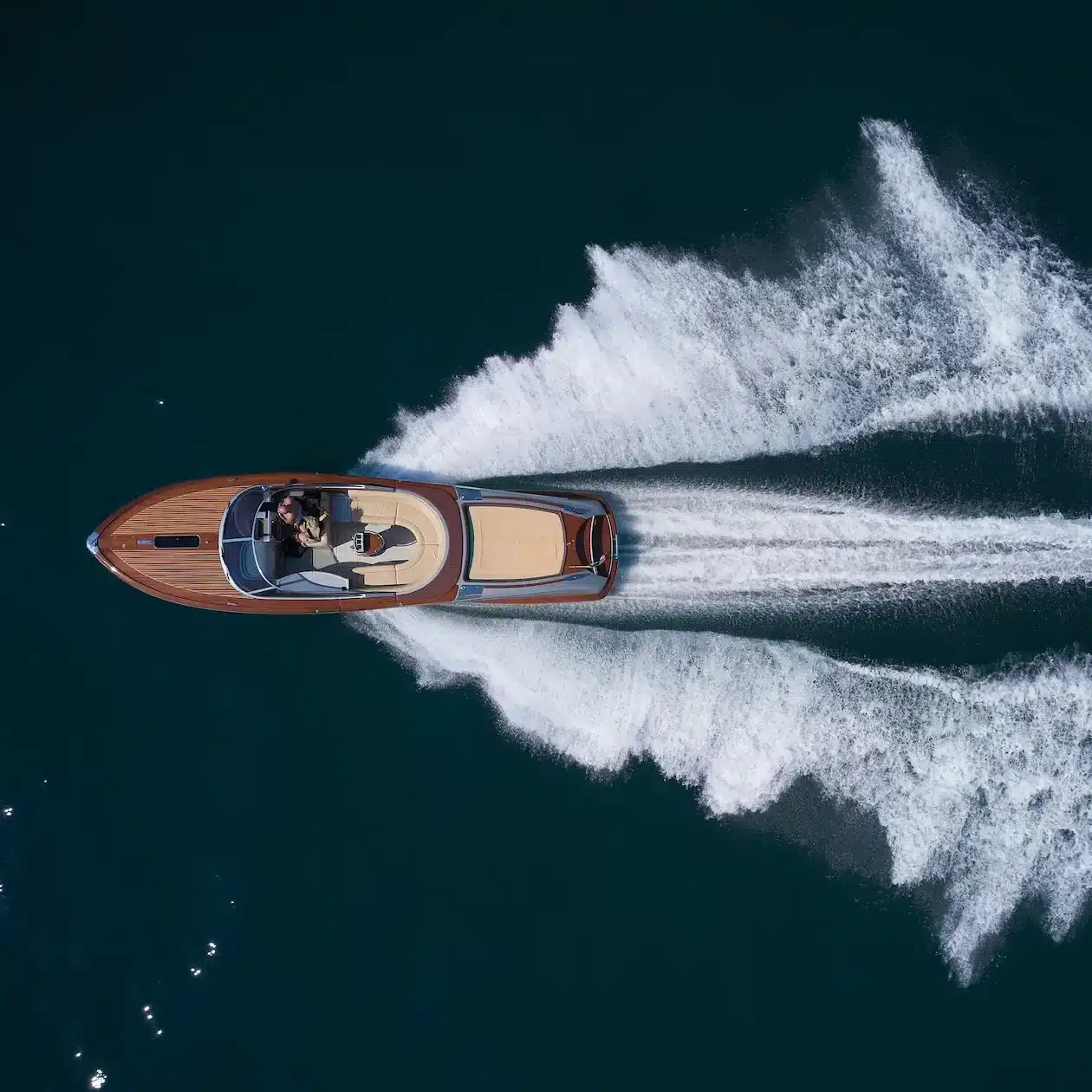 Aerial view of a speed boat ripping across the water