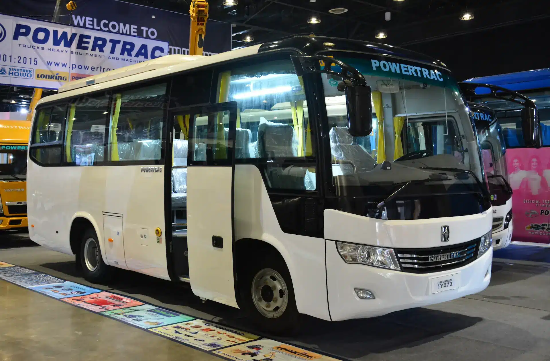 New Coaster Bus parked in front of the showroom
