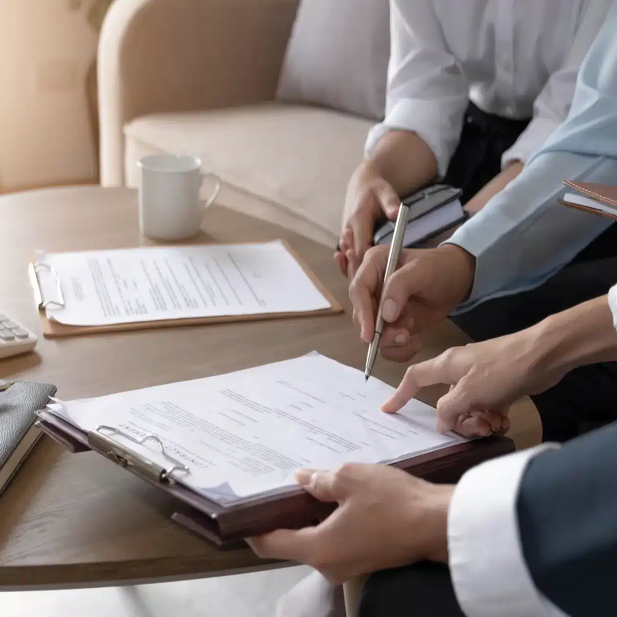 Business people signing documents for an agreement