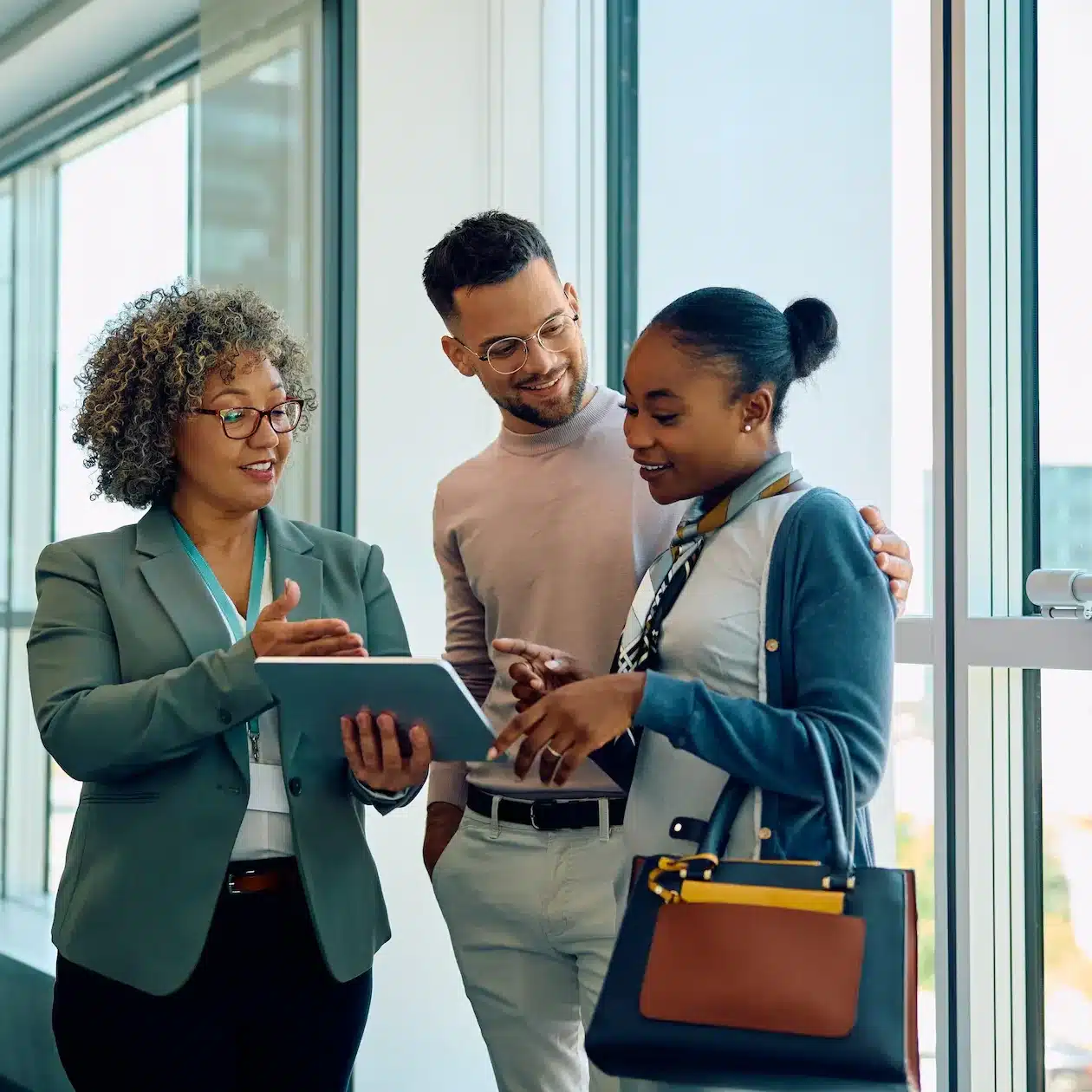 A couple are meeting with a professional loan broker to check on the health of their finances seeking to improve their position