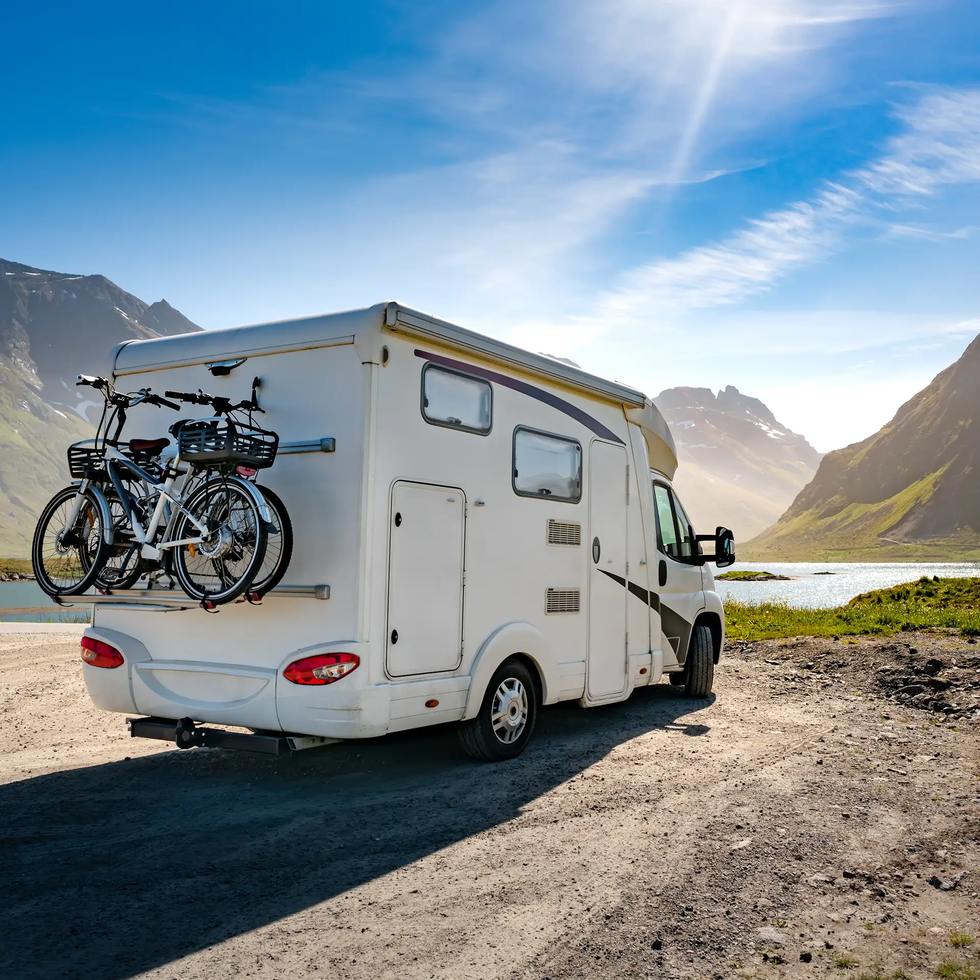 Caravan with bikes in a beautiful landscape