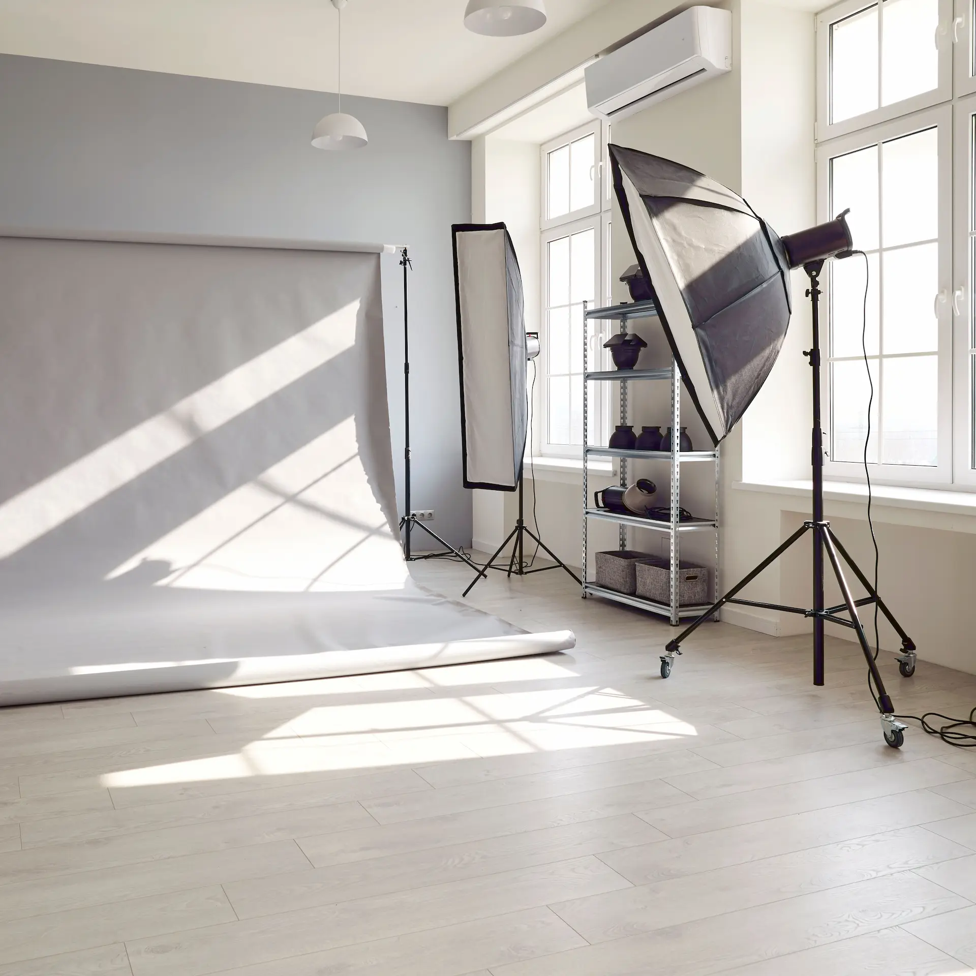 A photography studio with cyc, lighting and accessories ready for a photo shoot.