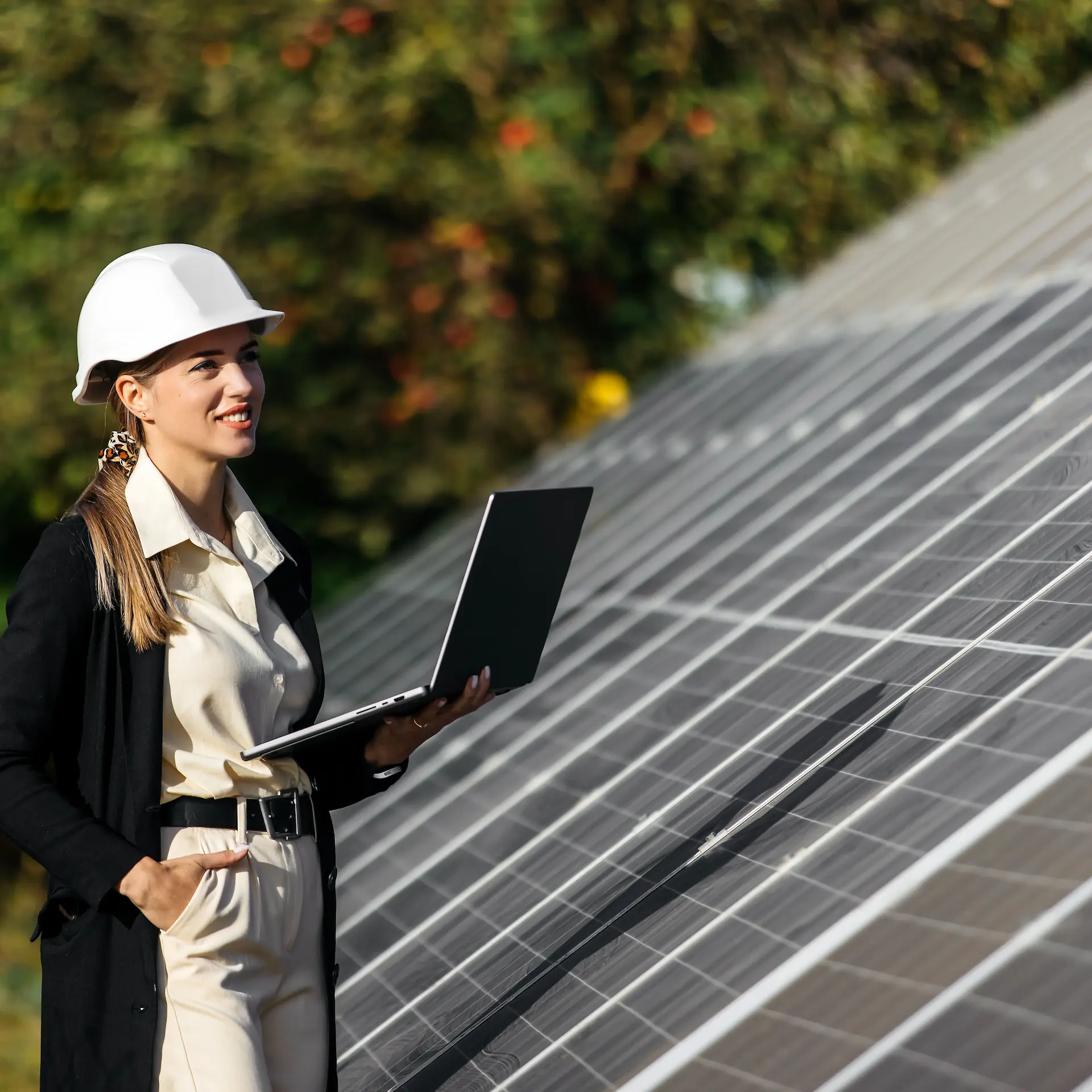 A business operator is checking the performance of the commercial solar equipment generating renewable energy for their enterprise.