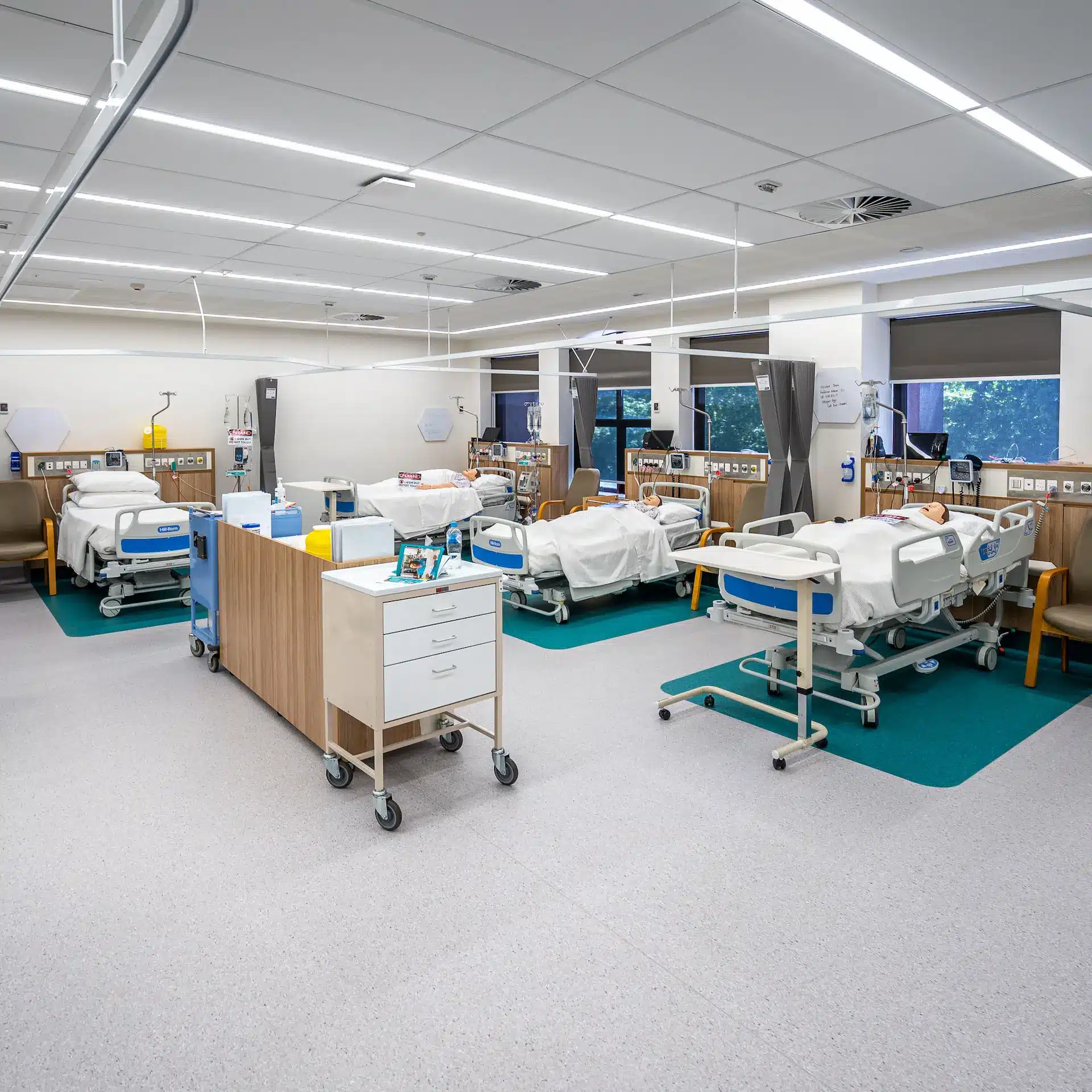 A hospital special care ward with patient beds and equipment.