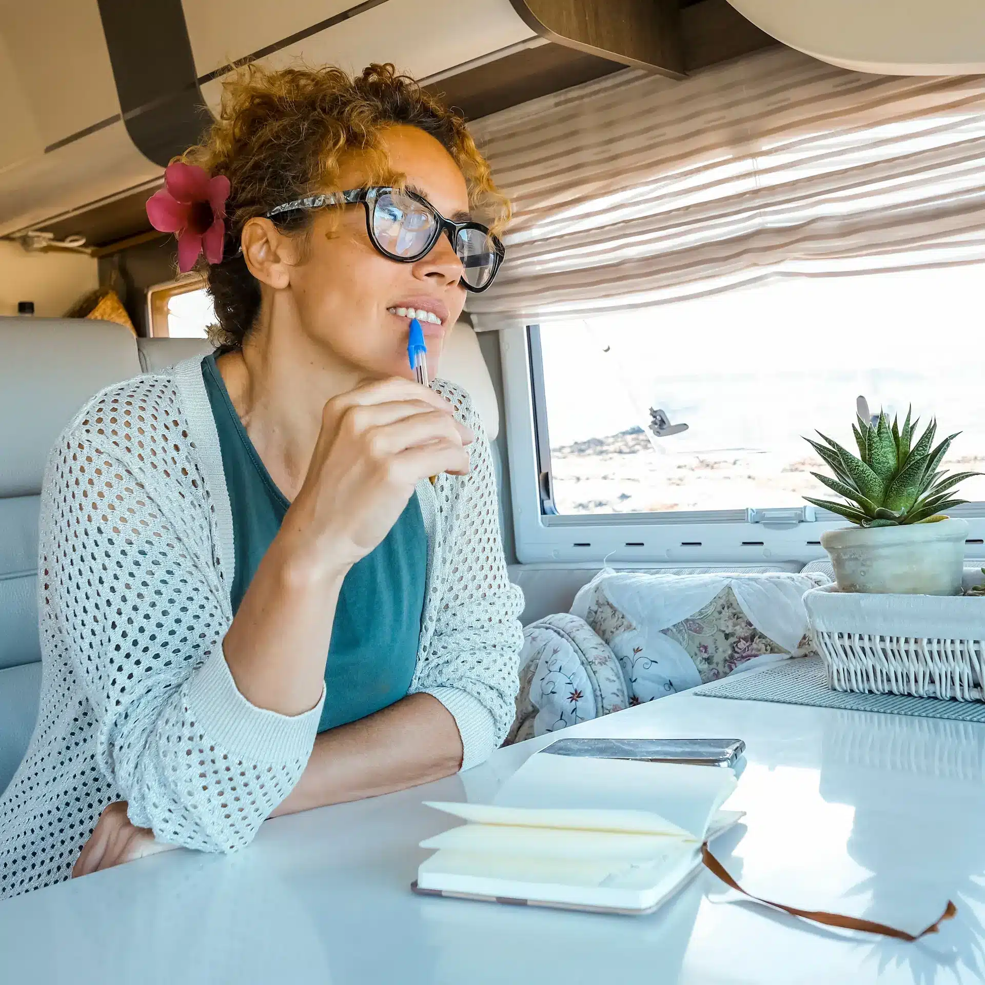A woman sitting in her RV is contemplating an upgrade, and contacted Jade Finance to explore her options.