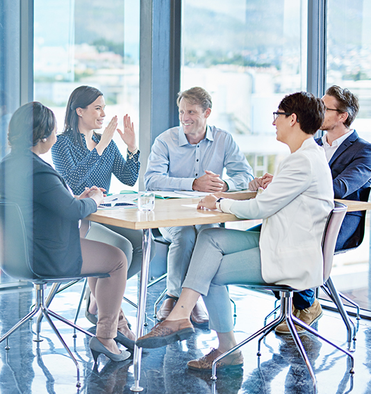 Corporate team in office meeting discussing marketing strategy